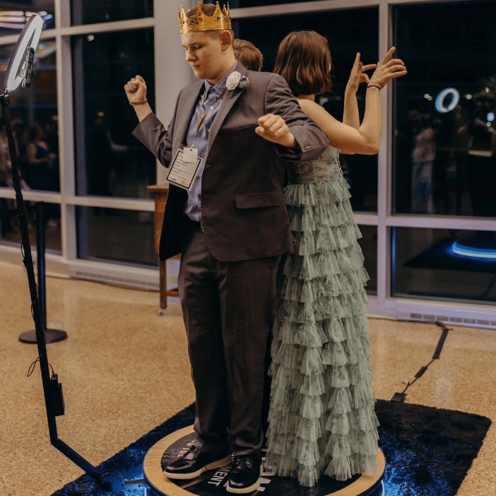 people dancing on a 360 photobooth
