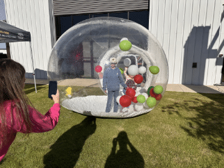 Family enjoying a giant snowglobe