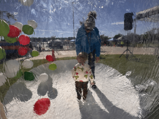 Father and child inside a giant snowglobe